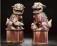 19th century A pair of flambe glazed models of Buddhistic lions